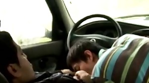 Japanese moil jock gives oral job in a car