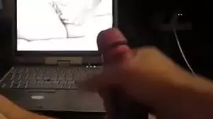 Jerking off his big dick under porn and big