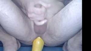 Zucchini ass plugged flaccid cock cum action