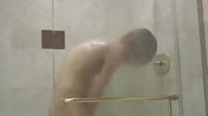 Skinny Kaylo Riley jerks off after steamy shower