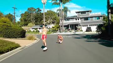 Longboard boys railing rigid on someone's skin