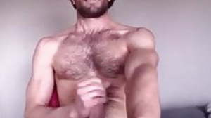 Bearded guy wanks on webcam