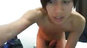 Impressive cock of an Asian boy gets jerked well