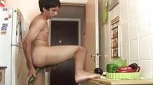 Lusty twink shoves a cucumber up the ass in the..