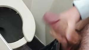Wank and cum in airplane bathroom